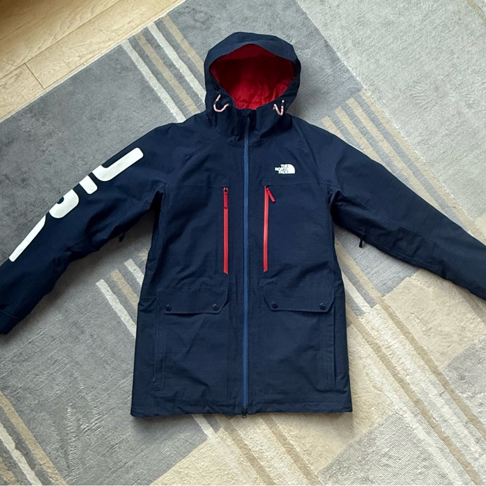 The North Face Team USA Men's Dark Blue Ski Jacket with Red Accents